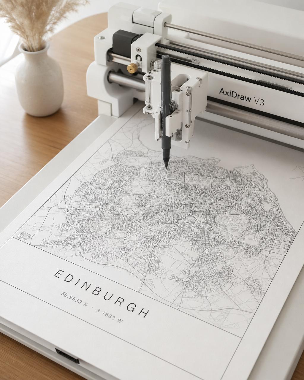 Plotted city street map on ivory paper beside a pen